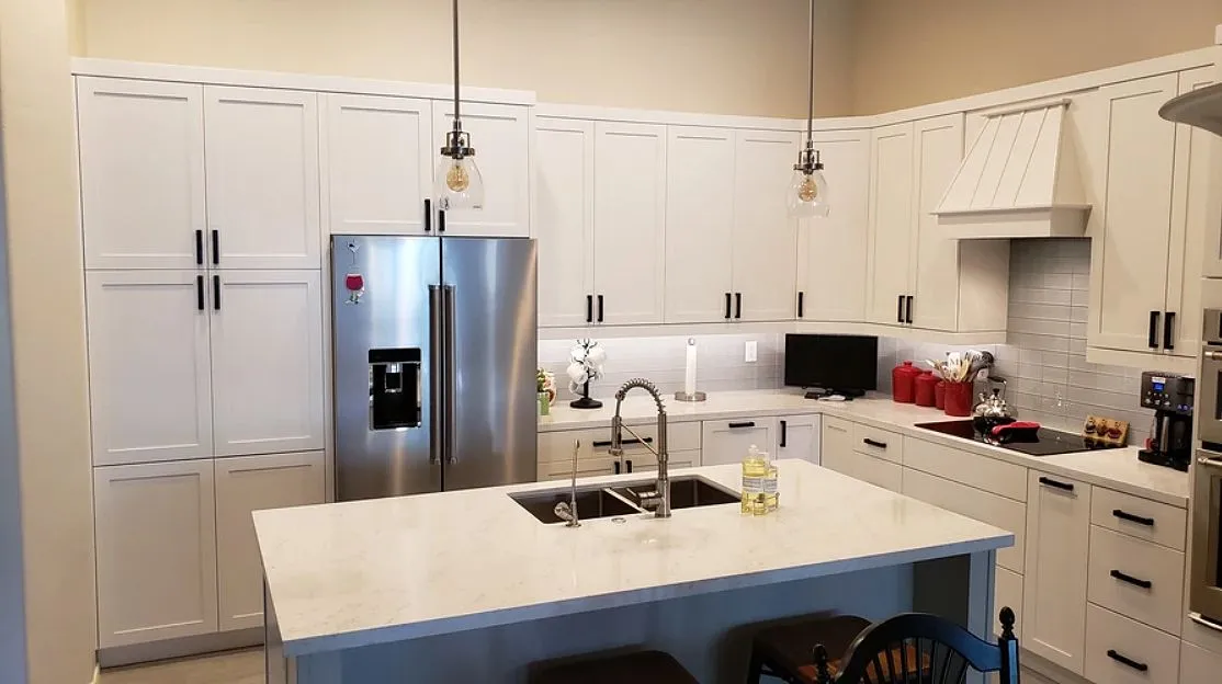 White shaker kitchen with quartz island - TJC Remodeling